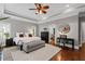 Stylish main bedroom with tray ceiling, ceiling fan, neutral walls, and plush carpeting at 18 Starlight Dr, Cartersville, GA 30121