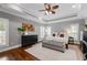 Spacious main bedroom with tray ceiling, ceiling fan, neutral walls, and plush carpeting at 18 Starlight Dr, Cartersville, GA 30121