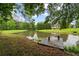 Scenic view of a pond with a wooden dock and lush greenery at 18 Starlight Dr, Cartersville, GA 30121