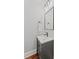 Elegant powder room featuring a vanity with dark hardware, a modern sink, and warm lighting at 18 Starlight Dr, Cartersville, GA 30121