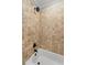 Detailed shower area with travertine tile and updated hardware at 18 Starlight Dr, Cartersville, GA 30121