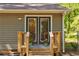 Back entrance with wooden deck and fenced-in yard at 944 Hardy Cir, Dallas, GA 30157