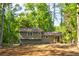 View of the back of the house showing the yard and fencing at 944 Hardy Cir, Dallas, GA 30157