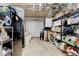 Unfinished basement area for storage with some items on shelves, a fridge, and other supplies at 944 Hardy Cir, Dallas, GA 30157