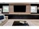 Basement living room area with a large TV and accent wall at 944 Hardy Cir, Dallas, GA 30157