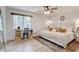 Bright bedroom featuring a cozy bed, desk nook by the window, and hardwood floors at 944 Hardy Cir, Dallas, GA 30157