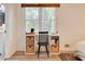 Bright desk nook by a large window, perfect for work or study, with natural light and storage baskets at 944 Hardy Cir, Dallas, GA 30157