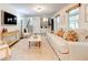 Spacious living room with a fireplace, stairway, built-in shelving and a neutral color palette at 944 Hardy Cir, Dallas, GA 30157