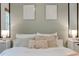 Close up on the pillows and decorations of the bed in the main bedroom with neutral color patterns at 944 Hardy Cir, Dallas, GA 30157
