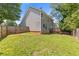 Grassy backyard enclosed by a wooden fence, offering privacy and space for outdoor activities at 109 Riley Way, Canton, GA 30115