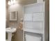 Bathroom with vanity sink, mirror and overhead cabinet at 109 Riley Way, Canton, GA 30115