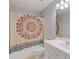 Cozy bathroom featuring a vanity with a sink and a shower/tub combination with a colorful mandala shower curtain at 109 Riley Way, Canton, GA 30115