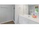 Bright bathroom with white vanity, a shower and tile floors at 109 Riley Way, Canton, GA 30115