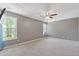 Spacious bedroom with two windows providing natural light and a ceiling fan for added comfort at 109 Riley Way, Canton, GA 30115