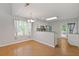 Bright dining area with hardwood floors, a window, and convenient access to the kitchen at 109 Riley Way, Canton, GA 30115