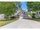 Charming home with a two-car garage and inviting front yard, offering curb appeal at 109 Riley Way, Canton, GA 30115