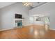Spacious living room featuring a fireplace, hardwood floors, and lots of natural light at 109 Riley Way, Canton, GA 30115
