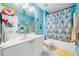 Bathroom with shower/tub combo, large mirror, and fun Moana theme at 1162 Apalachee Run Trl, Dacula, GA 30019