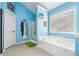 Bathroom featuring a standalone tub, a separate shower, and a large window at 1162 Apalachee Run Trl, Dacula, GA 30019