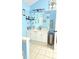Bathroom features a white vanity with ample storage and decorative mirror at 1162 Apalachee Run Trl, Dacula, GA 30019
