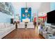 Expansive living room boasts hardwood floors, blue walls, and a cozy fireplace at 1162 Apalachee Run Trl, Dacula, GA 30019