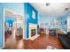 Cozy living room with a fireplace and hardwood floors, perfect for relaxing at 1162 Apalachee Run Trl, Dacula, GA 30019