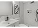 Modern bathroom with a white subway tile shower and black hardware at 1253 Willow Dr, Riverdale, GA 30296