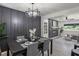 Stylish dining room with modern decor, unique lighting, and comfortable seating at 1253 Willow Dr, Riverdale, GA 30296