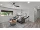 Comfortable living room with a large window, contemporary furniture, and modern lighting at 1253 Willow Dr, Riverdale, GA 30296
