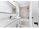 Bathroom featuring white vanity, large mirror and shower and tub combo at 206 Regester Way, Peachtree City, GA 30269