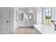 Elegant bathroom with double vanity, freestanding tub, and stylish fixtures at 206 Regester Way, Peachtree City, GA 30269