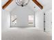 Bright bedroom with vaulted ceiling, beams, and two windows offering natural light at 206 Regester Way, Peachtree City, GA 30269