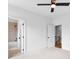 Bright bedroom featuring vaulted ceiling, ceiling fan and two doors at 206 Regester Way, Peachtree City, GA 30269