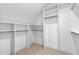 Walk-in closet with built-in shelving and plenty of storage space at 206 Regester Way, Peachtree City, GA 30269