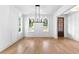 Spacious dining area with hardwood floors, white walls, natural light from multiple windows, and decorative molding at 206 Regester Way, Peachtree City, GA 30269