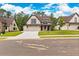 Beautiful home featuring a manicured lawn, elegant exterior, and an attached two-car garage at 206 Regester Way, Peachtree City, GA 30269