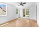 Bright living area with hardwood floors and access to outdoor living space through glass doors at 206 Regester Way, Peachtree City, GA 30269