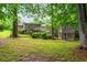 Expansive backyard with bridge to additional structure at 3549 Dogwood Dr, Powder Springs, GA 30127