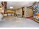 Unfinished basement area with shelving and doorway at 3549 Dogwood Dr, Powder Springs, GA 30127