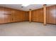 Basement featuring paneled walls and supporting columns at 3549 Dogwood Dr, Powder Springs, GA 30127