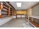 Unfinished basement area with workbench and shelving units at 3549 Dogwood Dr, Powder Springs, GA 30127