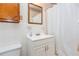 Bathroom with a white sink, white tile walls, and a shower with curtain at 3549 Dogwood Dr, Powder Springs, GA 30127