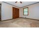 Bedroom with ceiling fan, carpet, and closet at 3549 Dogwood Dr, Powder Springs, GA 30127