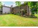 Traditional brick home with a well-maintained lawn and landscaped garden beds at 3549 Dogwood Dr, Powder Springs, GA 30127