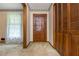 Foyer with carpet, closet, and window offering natural light, creating a welcoming ambiance at 3549 Dogwood Dr, Powder Springs, GA 30127