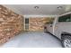 Attached brick garage with a silver truck parked on a painted concrete floor at 3549 Dogwood Dr, Powder Springs, GA 30127