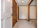 Hallway with carpet, closet, and neutral walls providing access to various rooms in the home at 3549 Dogwood Dr, Powder Springs, GA 30127