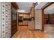 Inviting entryway with floral wallpaper, wood accents, and access to the kitchen for easy navigation and flow at 3549 Dogwood Dr, Powder Springs, GA 30127