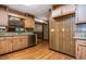 Classic kitchen with wooden cabinetry, stone countertops, and stainless steel dishwasher at 3549 Dogwood Dr, Powder Springs, GA 30127