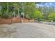 Outdoor basketball court with two hoops, steps and landscaping at 840 Yosemite Dr, Suwanee, GA 30024